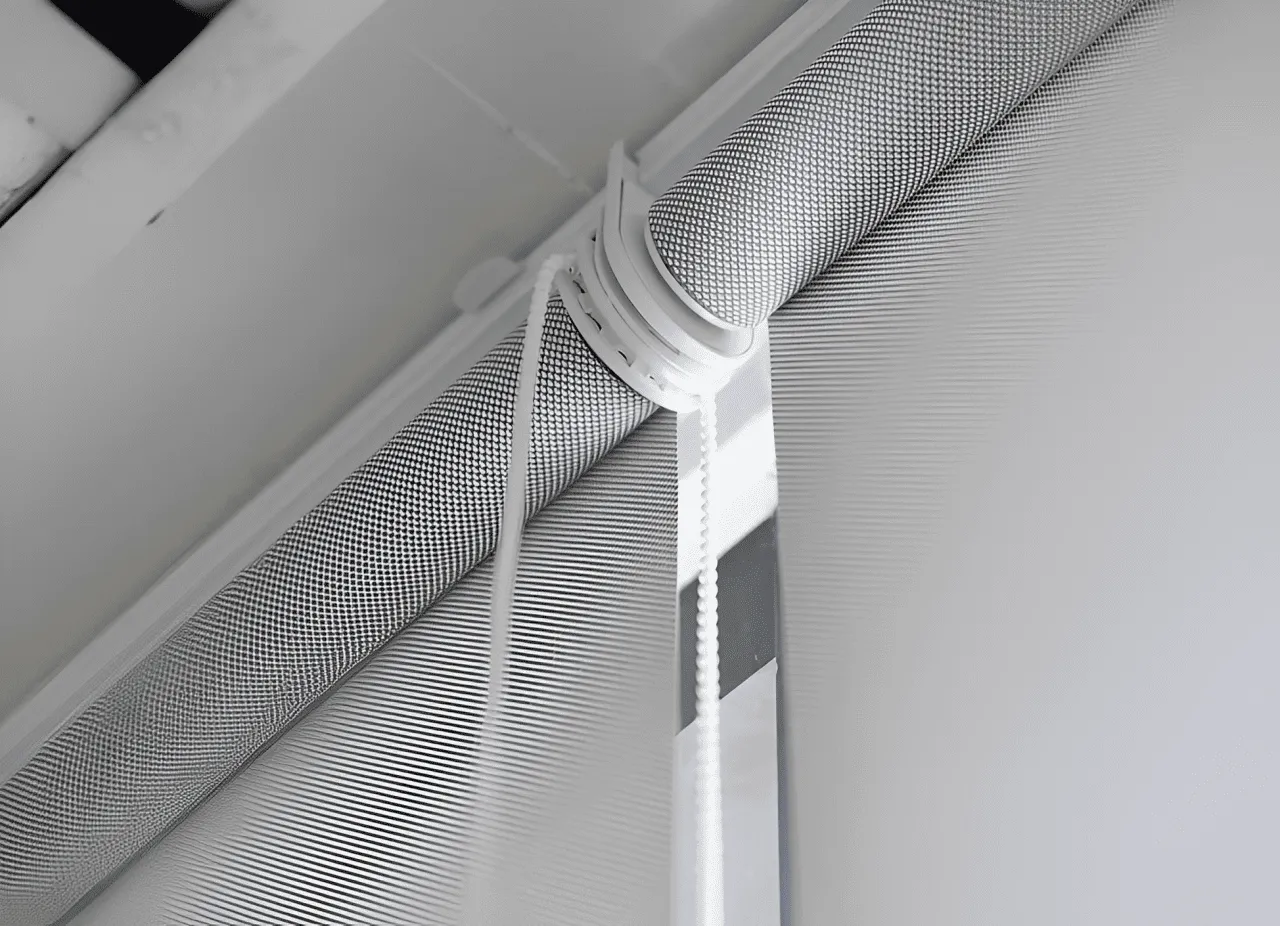 Close-up of a window featuring a delicate white curtain gently draping down, allowing soft light to filter through.